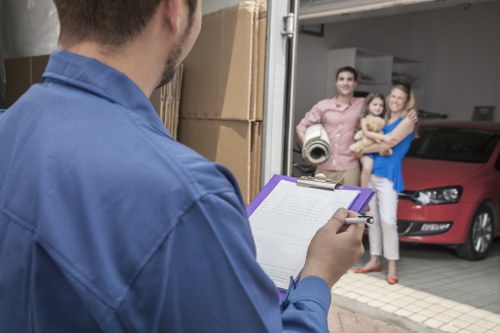 Moving van outside a Battersea apartment building with boxes ready
