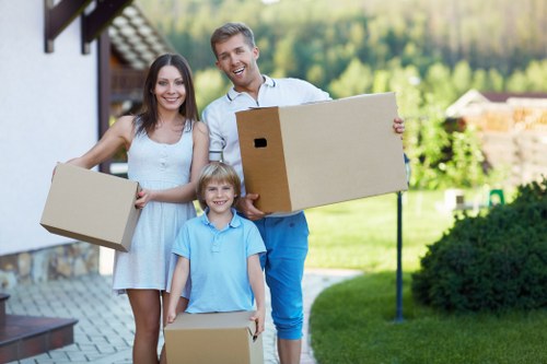 Careful loading of household furniture into a moving van in Battersea