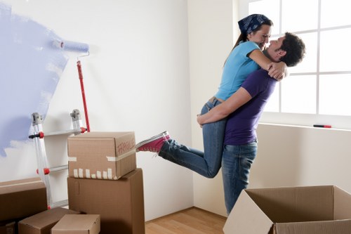 Packed moving boxes and furniture ready for transport in Battersea