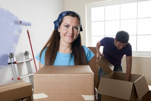 Professional office relocation team handling office furniture in Battersea